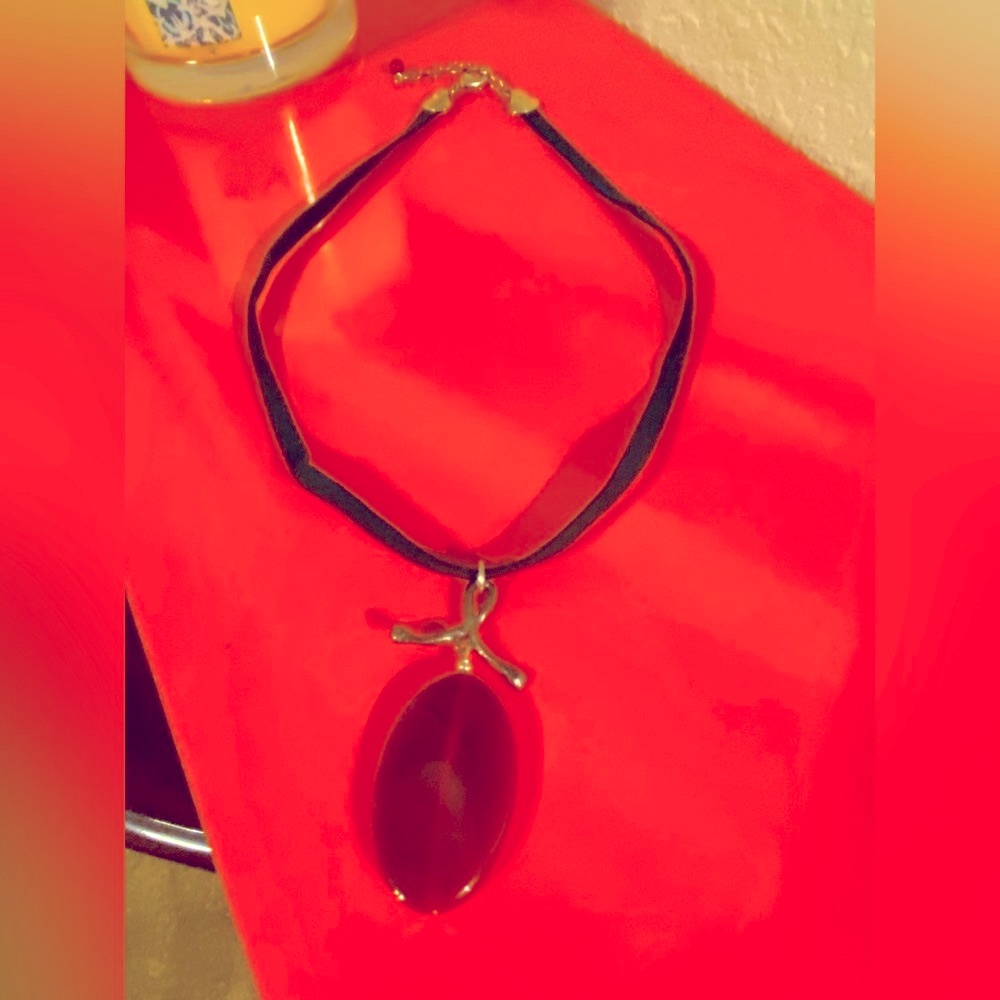 Ruby Cabochon pendent necklace on suede cording. 16” that extends.